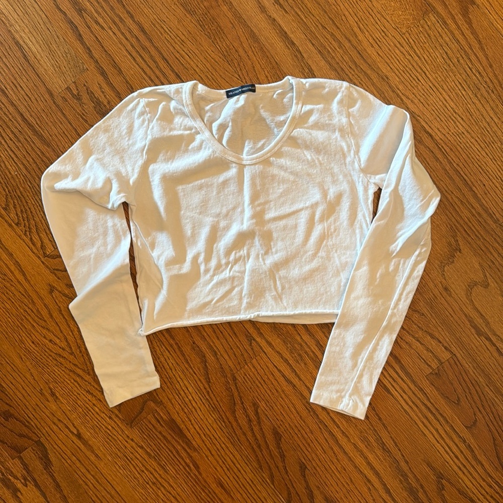 NWOT Brandy Melville long sleeve crop top in white. Super cute. Never worn!